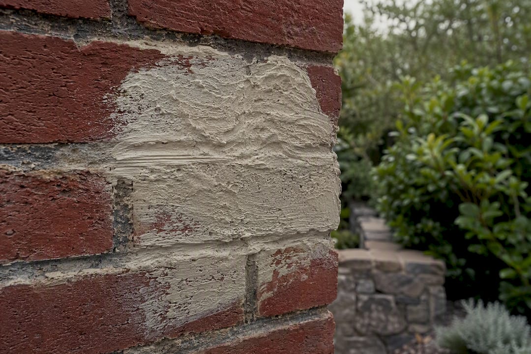 Poultice paste applied on old brick surface