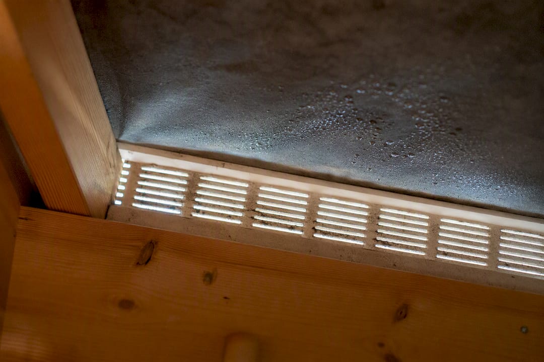 Blocked soffit vent showing loft moisture
